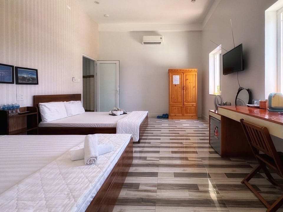 Superior Quadruple Room, City View | Free minibar items, desk, laptop workspace, soundproofing