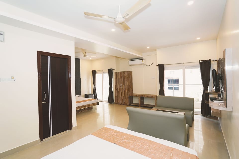 Deluxe Quadruple Room | Desk, laptop workspace, blackout drapes, free WiFi