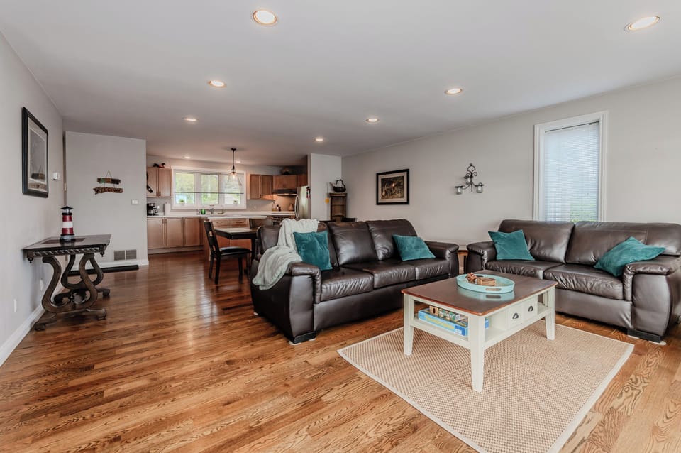 The bright, open living space with hardwood floors, comfortable seating, and tasteful décor creates a welcoming retreat. Perfect for relaxing after a day of kayaking, hiking, or exploring the Bruce Peninsula’s natural wonders.