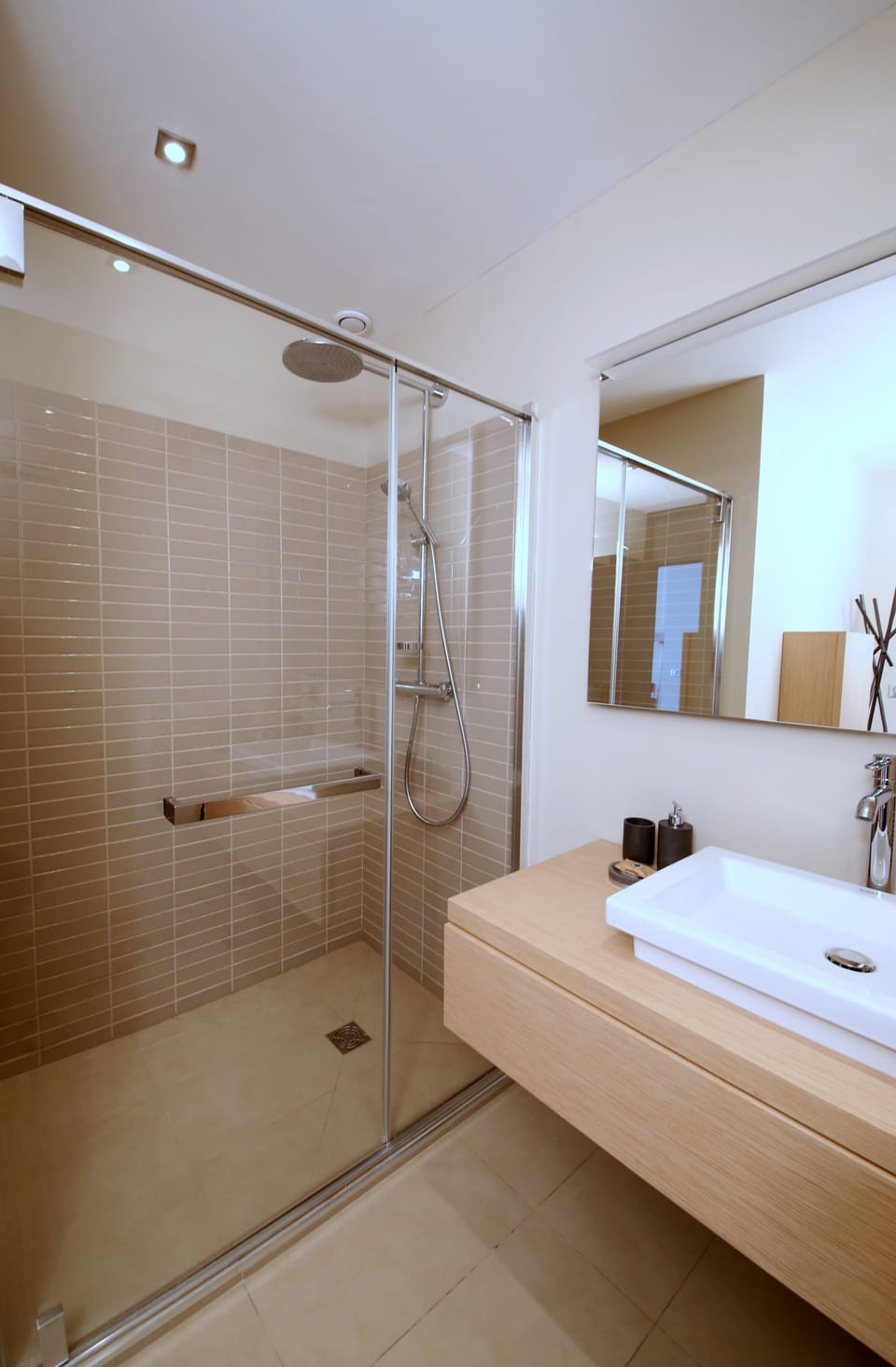 Bathtub, designer toiletries, hair dryer, bathrobes