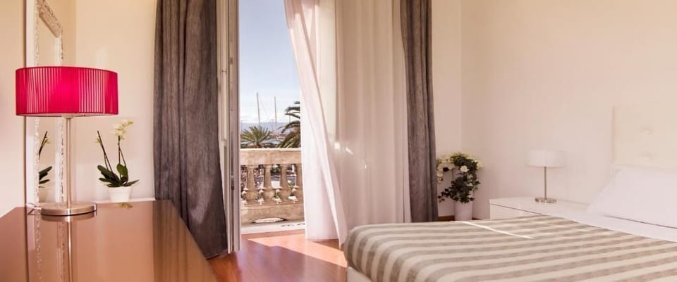 Deluxe Triple Room, Balcony, Sea View | In-room safe, desk, laptop workspace, iron/ironing board