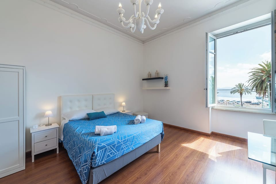 Deluxe Triple Room, Sea View | In-room safe, desk, laptop workspace, iron/ironing board