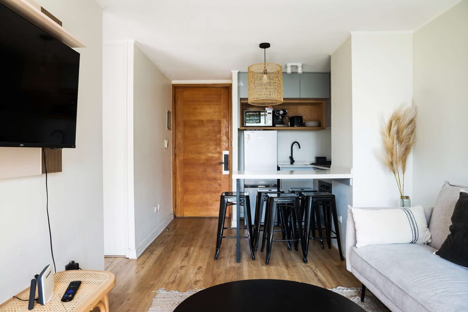 Cozy living area with modern amenities and a convenient kitchenette, perfect for relaxing after exploring the city.