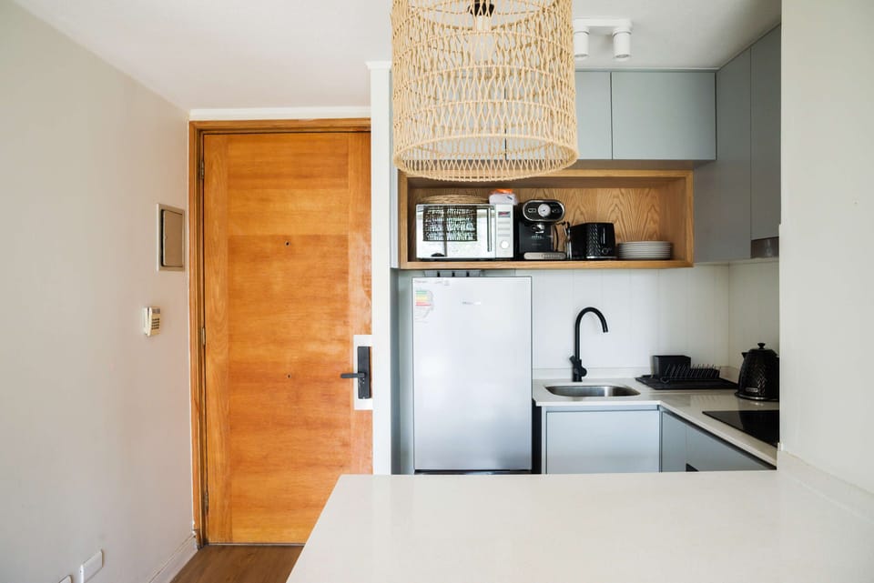 Chic and modern kitchen with all essentials for a cozy stay in the heart of the city.