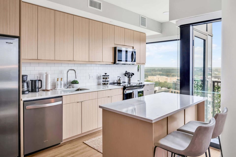Kitchen with cooking essentials including microwave, oven, ice machine, dishwasher