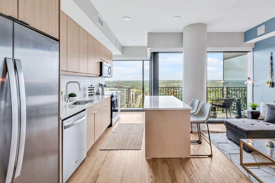 Kitchen with cooking essentials including microwave, oven, ice machine, dishwasher