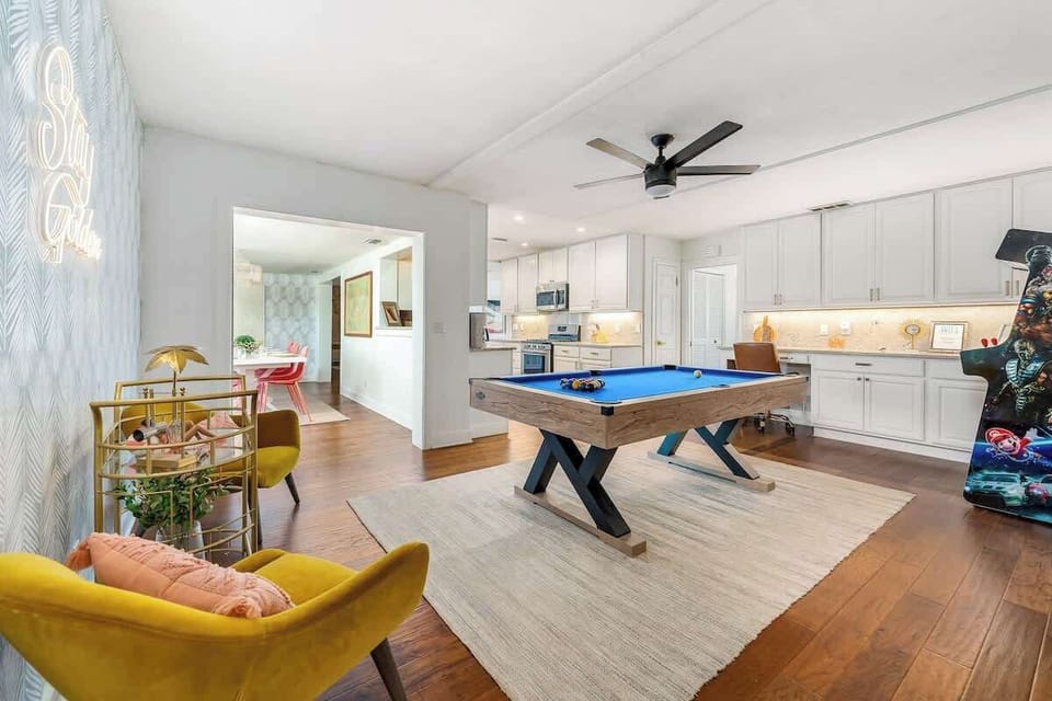 Game room opening to dining room and kitchen.