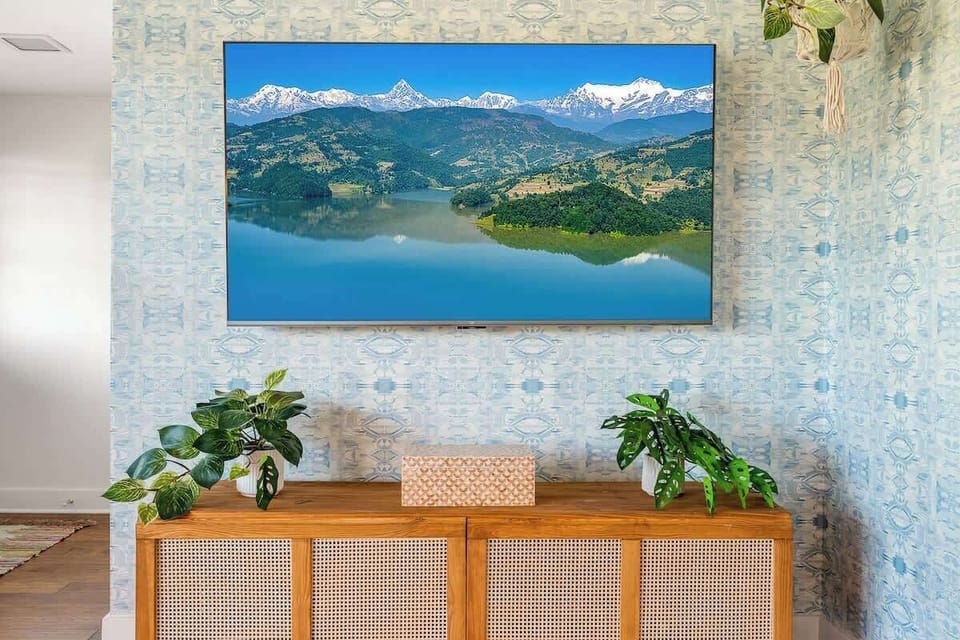 65 inch smart TV in living room.