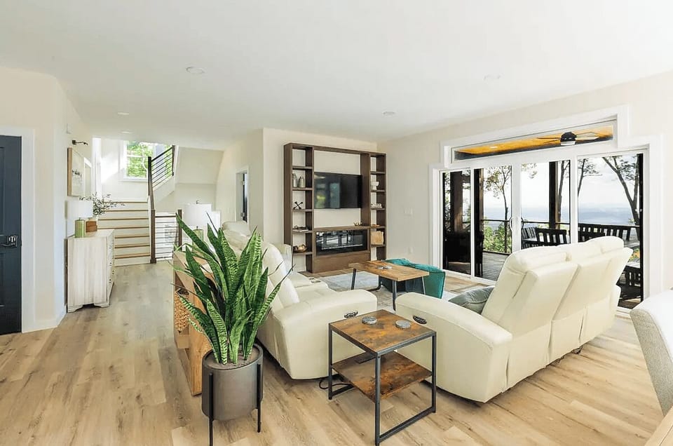 Spacious living room with comfortable seating, fireplace, and Smart TV.