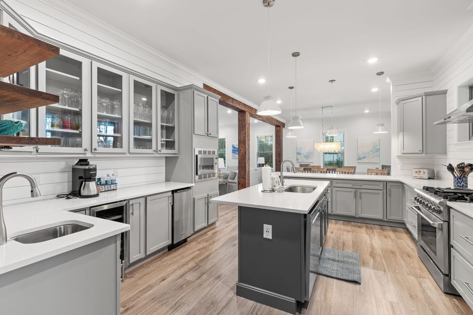 Your gourmet kitchen features modern appliances, elegant pendant lighting, and a spacious island perfect for cooking memorable meals together.