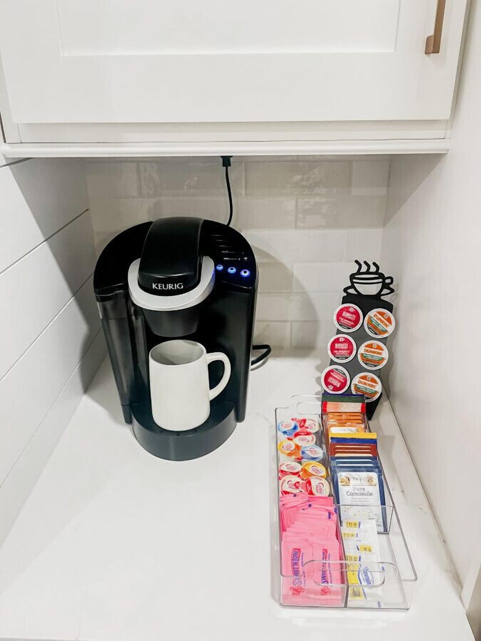 Your morning coffee station is stocked and ready - Keurig, pods, tea, sugar, the works - because the best part of waking up shouldn`t require a grocery run