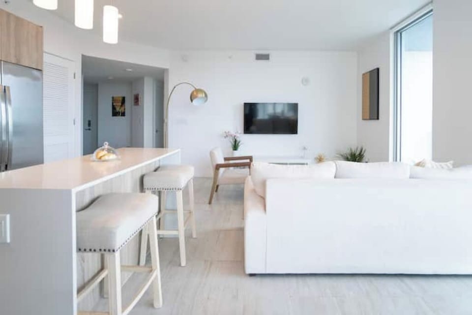 An open-concept layout connects the kitchen and living areas.