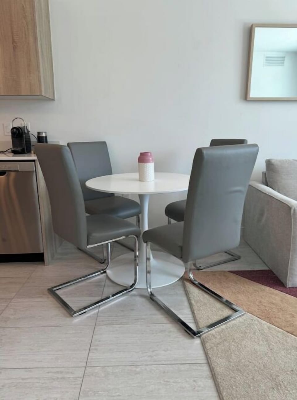 Modern dining area with a sleek round table.