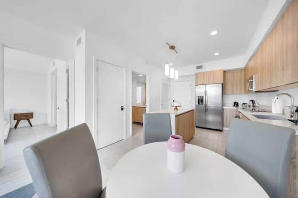 The dining area sits between the kitchen and living space.
