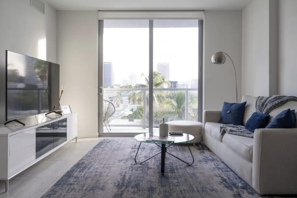 The open-concept living space with balcony access.