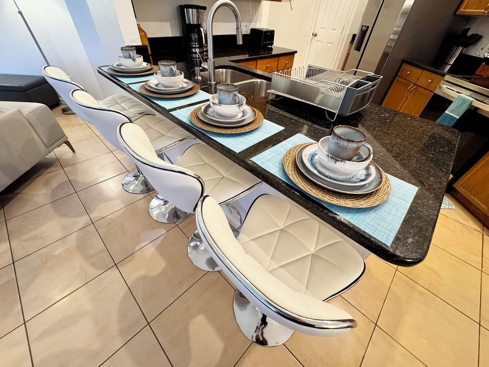 Have a few drinks at the kitchen island while watching the designated chef in action.
