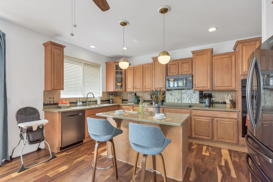 Kitchen island with bar seating for 2; high chair available