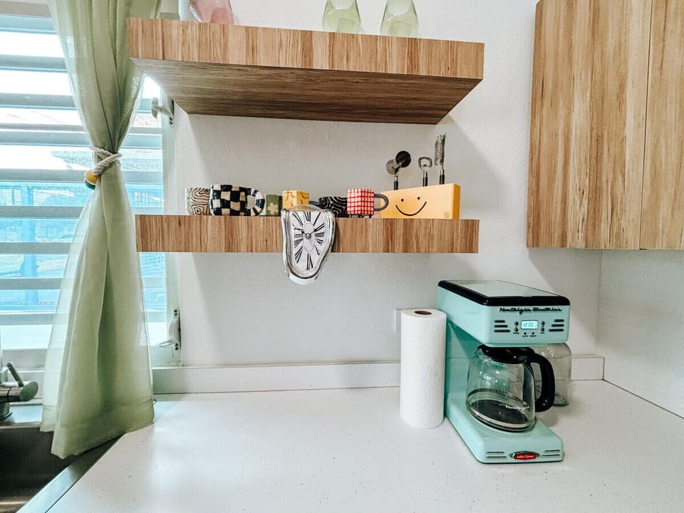 Spacious countertops and vibrant details make this kitchen a joy to use.