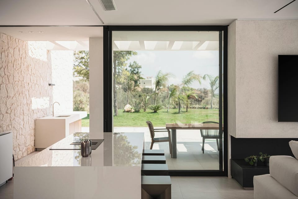The island with its four sleek stools, creates the perfect setting for your morning coffee.