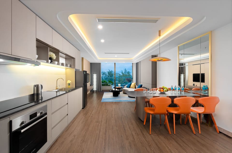 Grand Apartment, Balcony, Ocean View | Living area | 45-inch TV with cable channels, printers