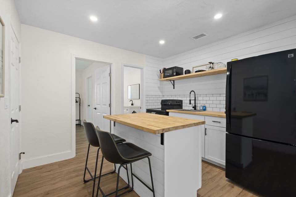 Gather around the kitchen island with seating perfect for meals, snacks, or morning coffee.
