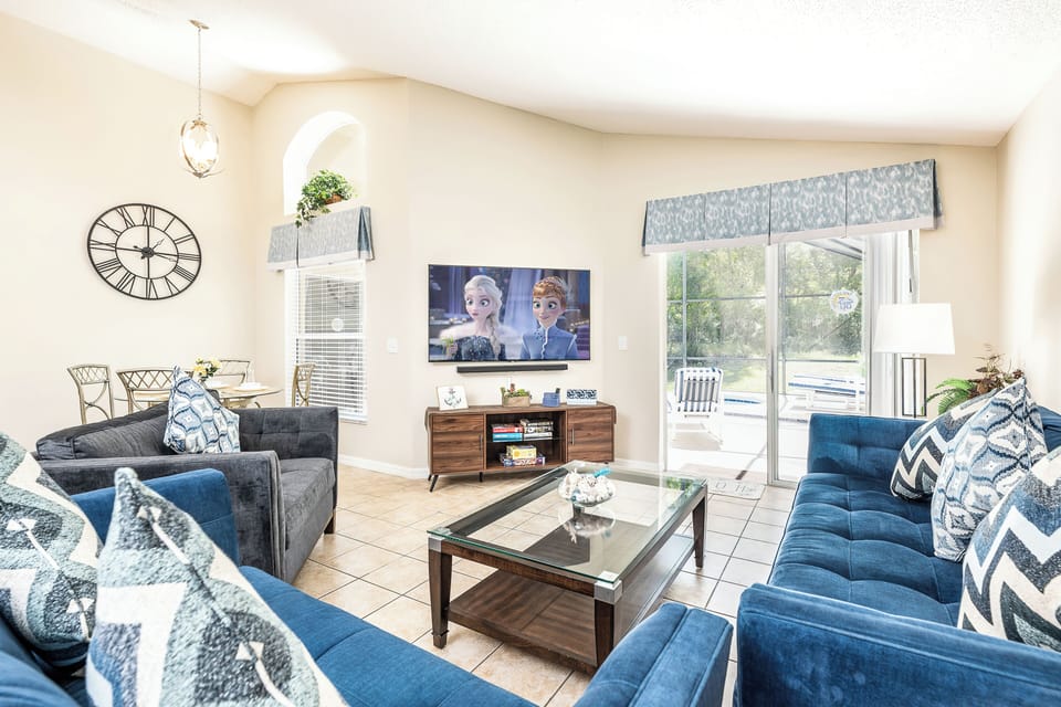 Living area with access to pool area 