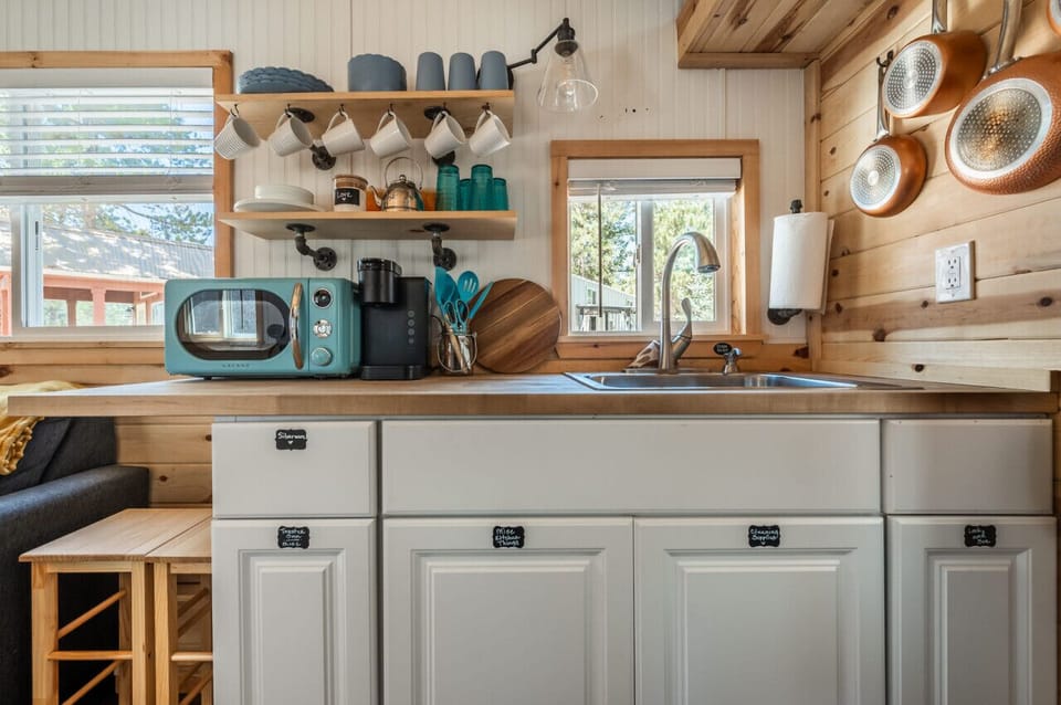 Sunshine streams into this charming kitchenette, making it the ideal spot for morning coffee.