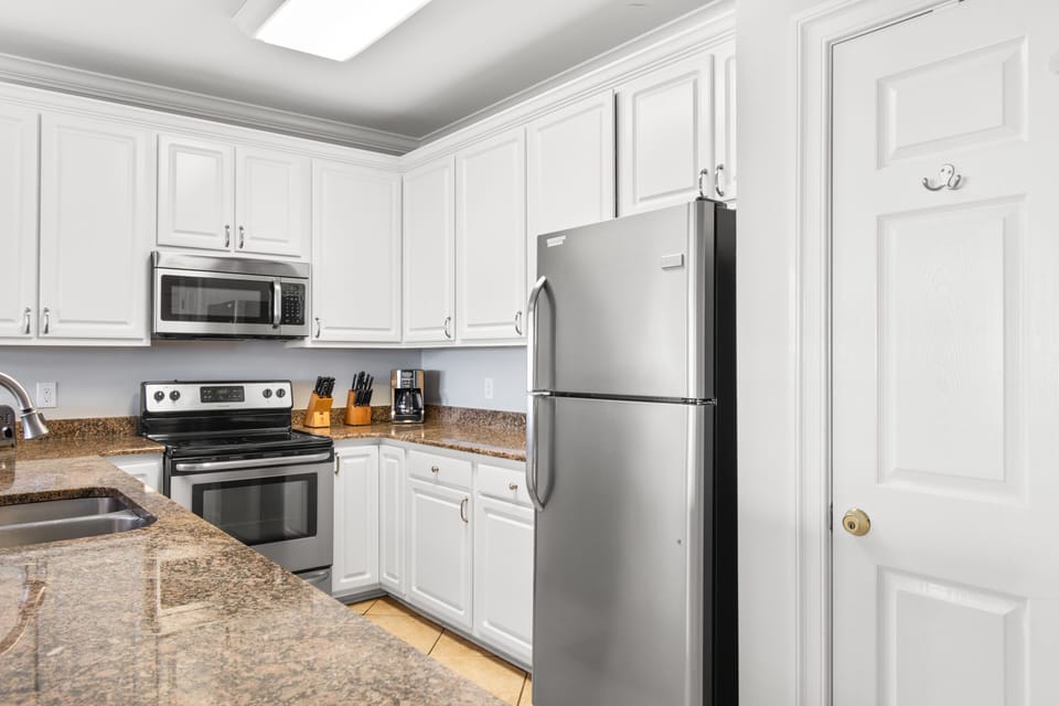 Your fully equipped kitchen awaits with modern appliances and granite counters, perfect for creating memorable meals during your stay.