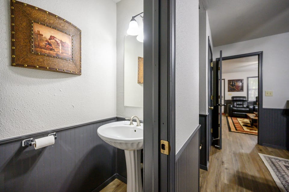 A half bath with toilet and sink is attached to the bedroom for your convenience!