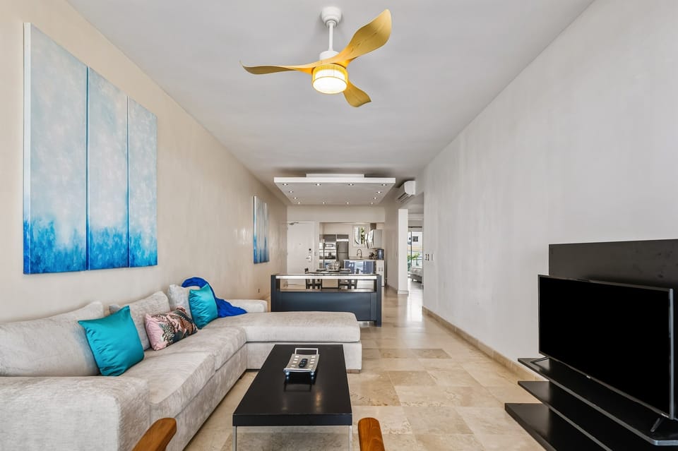 Comfortable living room with air conditioning, stylish décor, and a relaxed atmosphere for unwinding after the beach.