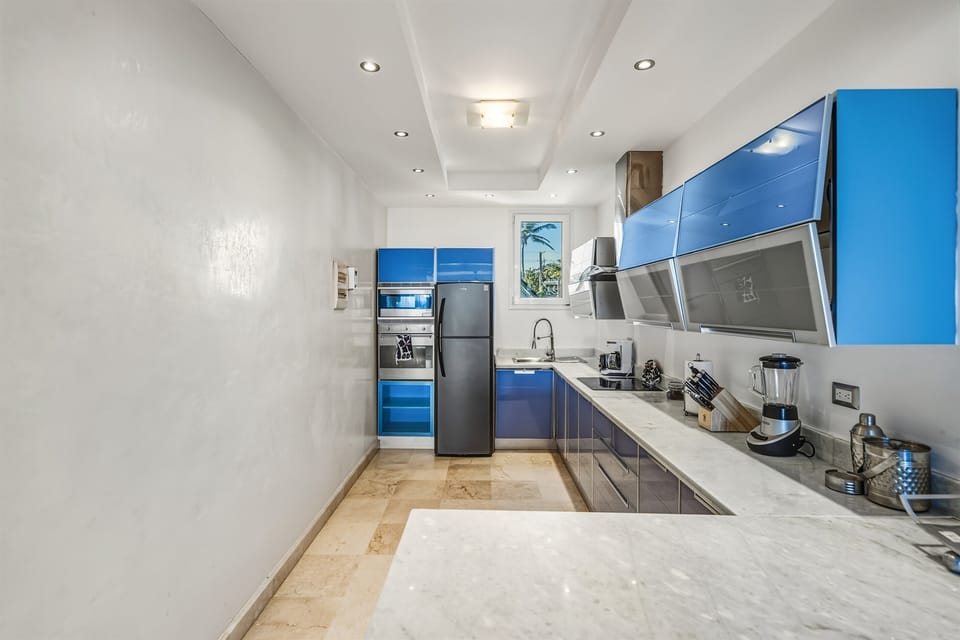Fully equipped modern kitchen with sleek finishes, quality appliances, and everything needed to cook comfortably.