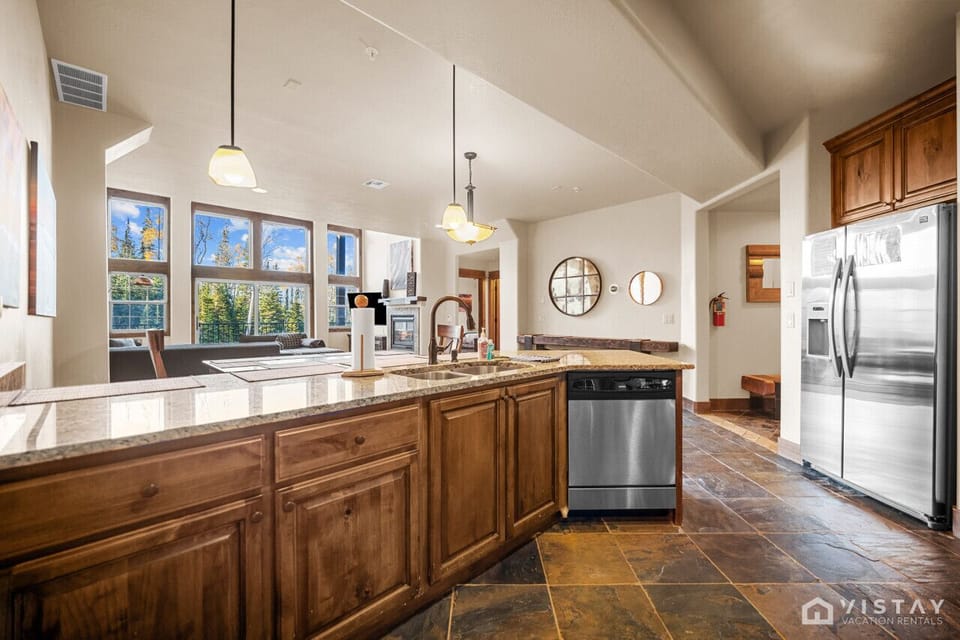 Embrace open living: prepare feasts with nature`s grand vista beyond.