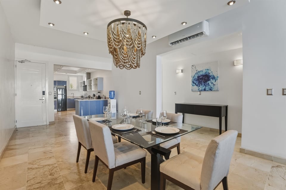 Imagine sharing meals here after a day at the beach. A stylish dining space connected to the oceanfront living area, perfect for relaxed breakfasts and memorable dinners