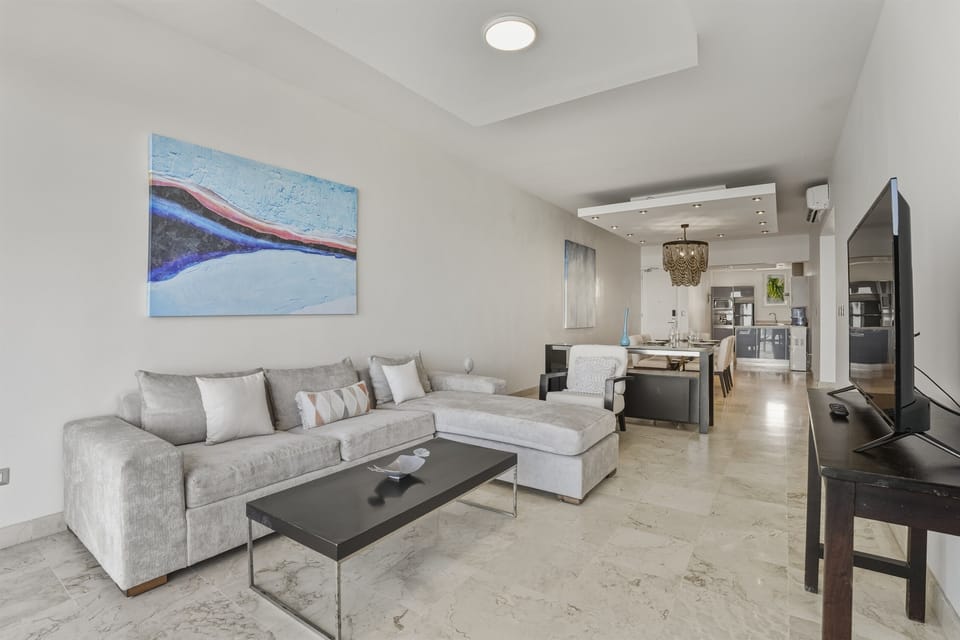 Bright, oceanfront living room with air conditioning and fast Wi-Fi. A comfortable space to relax, unwind, or work remotely while enjoying the view.