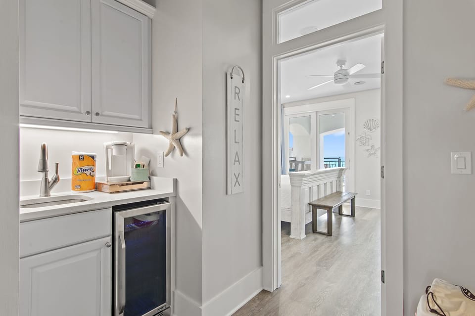 Small Kitchenette on First Floor with mini-fridge, sink, and Keurig