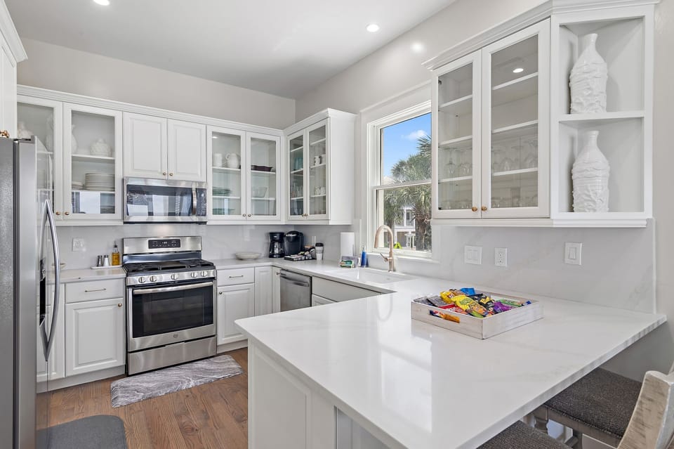 Remodeled Kitchen with granite countertops, stainless appliances - cook delicious meals and dine while overlooking the Gulf of Mexico!