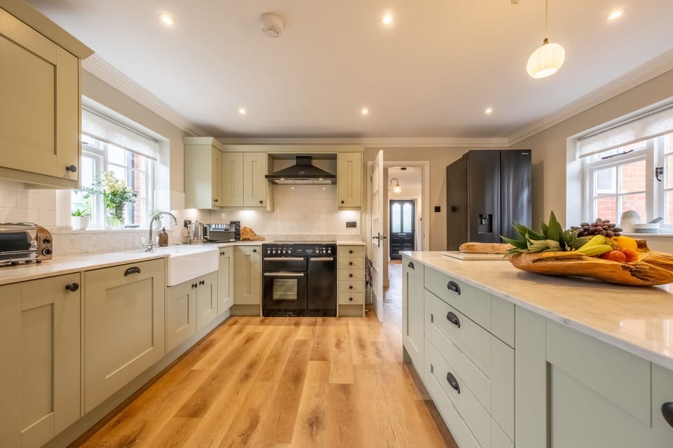 Ground floor: Kitchen with Rangemaster cooker with electric hob, microwave, fridge/freezer, double Butler's sink, dishwasher and Nespresso Magimix coffee machine