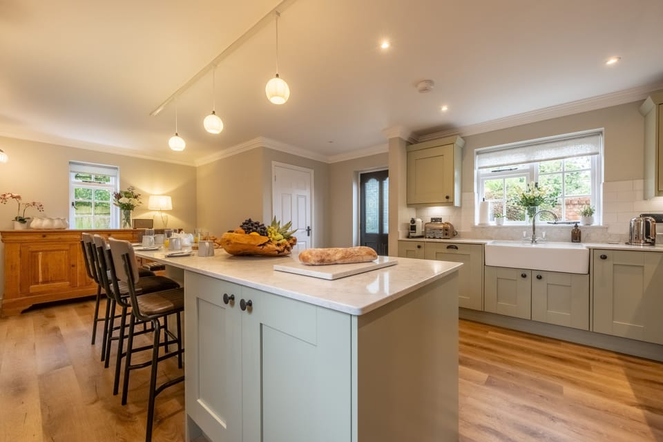 Scarrowbeck House, Hanworth: Kitchen with long length sit up/breakfast bar with seating