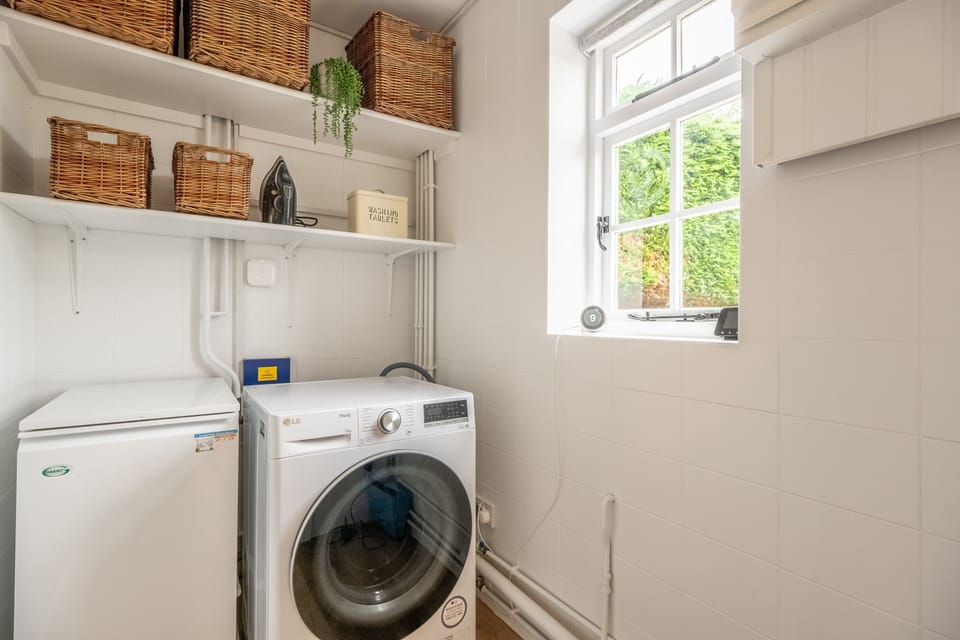 Ground floor: Utility with washing machine.