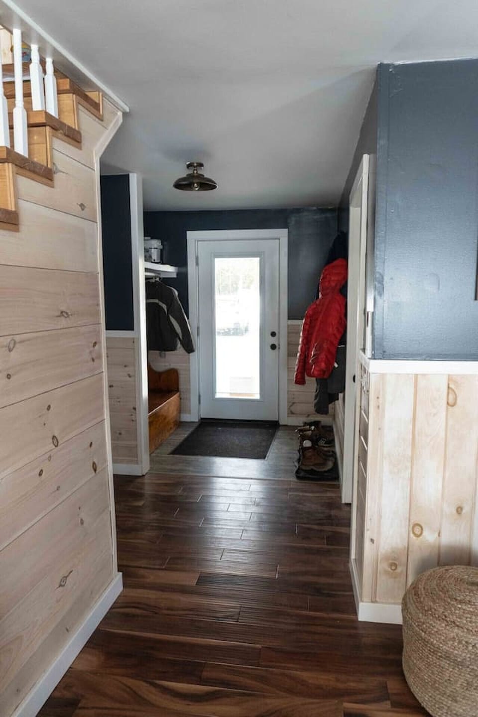 Spacious entryway features plenty of hooks for jackets and additional storage for belongings.