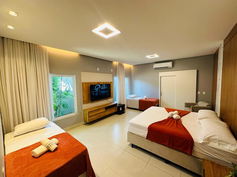 Luxury Triple Room, Garden View | Premium bedding, down comforters, desk, laptop workspace