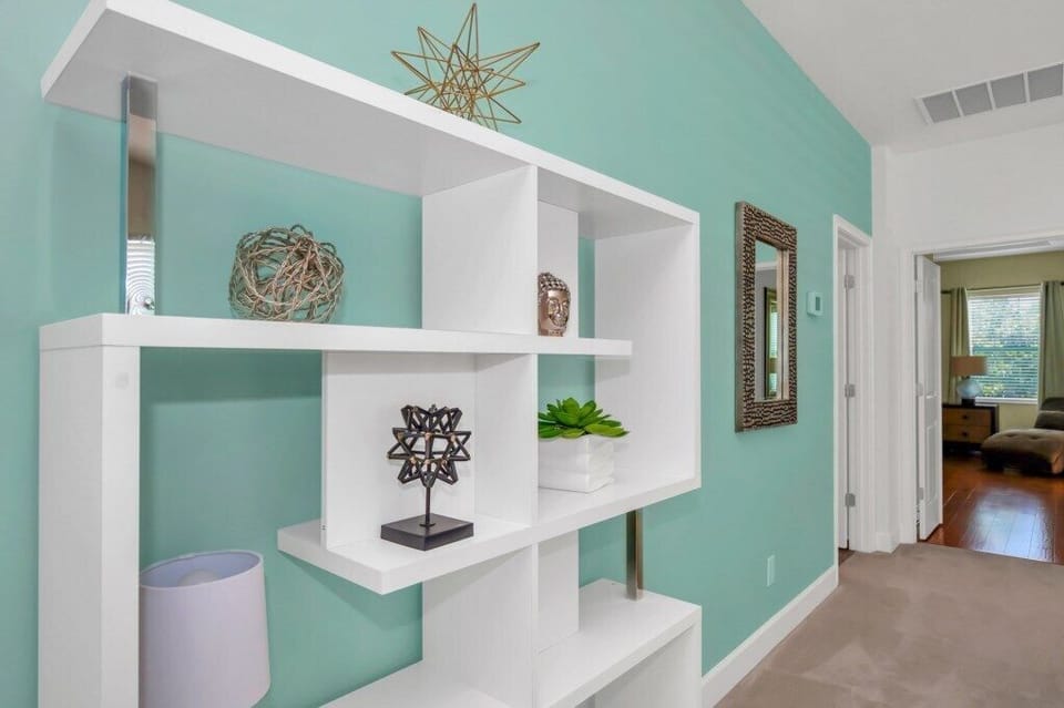Stylish loft space with built-in shelving adds flair and extra room to relax.