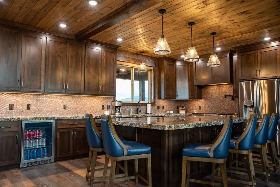 Chef's kitchen with island and seating for six.