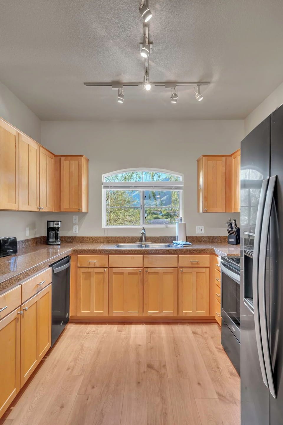 A full kitchen with tons of storage space, and a variety of small appliances 