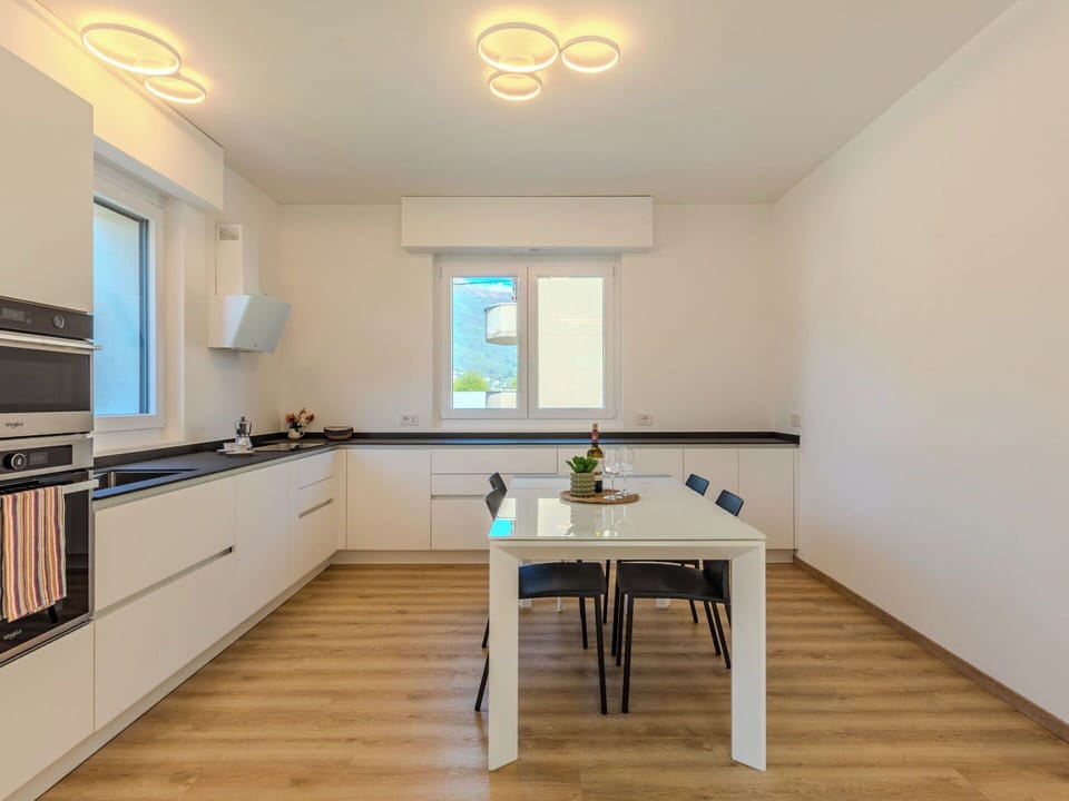 Interior Design, Furniture, Flooring, Wall, Kitchen, Countertop, Wood, Light Fixture, Ceiling, Floor