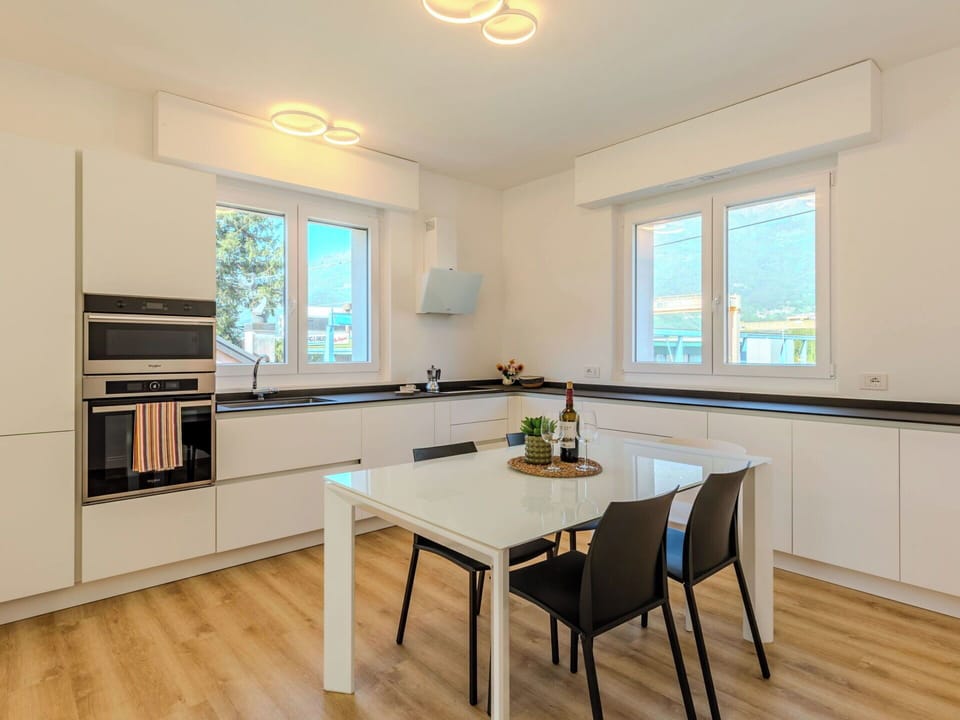 Furniture, Interior Design, Flooring, Kitchen, Wood, Countertop, Ceiling, Floor, Light Fixture, Home