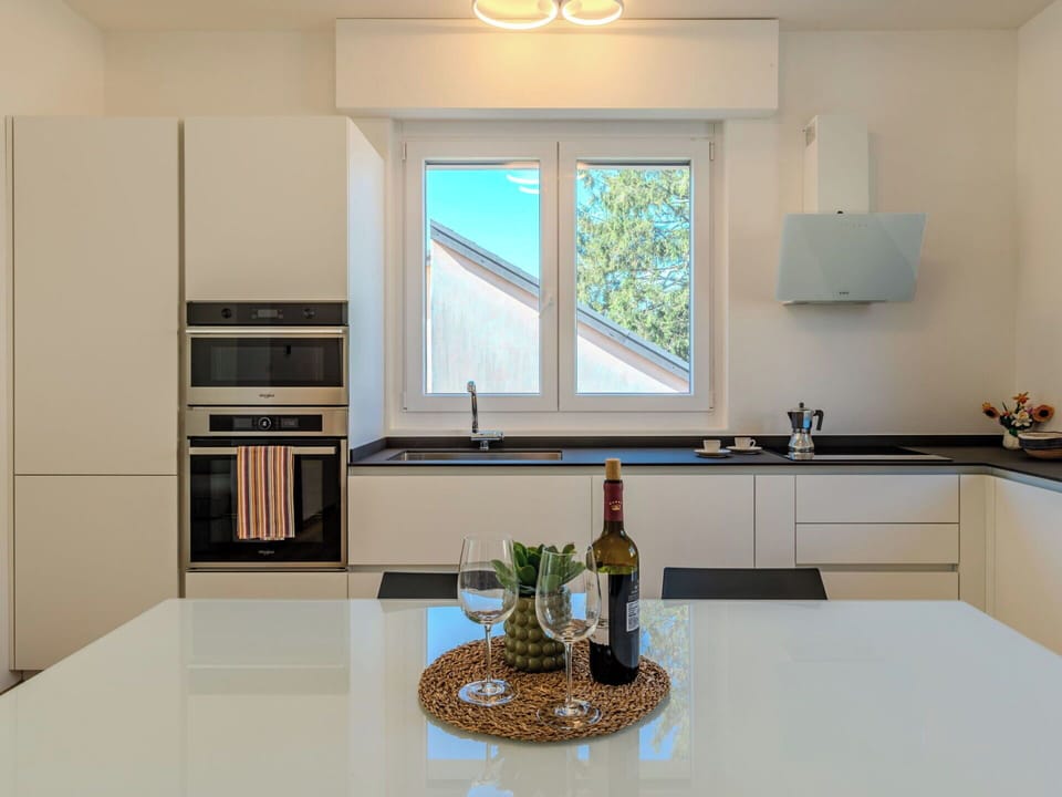 Kitchen, Interior Design, Countertop, Wall, Furniture, Kitchen Appliance, Flooring, Wood, Cabinetry, Light Fixture