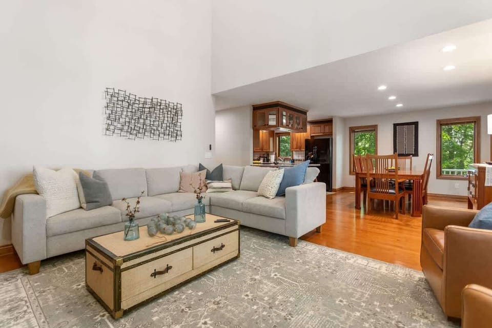 The main level features an open floor plan connecting the kitchen, dining area, and living room, offering easy maneuvering and visibility, perfect for connection in this home away from home. 