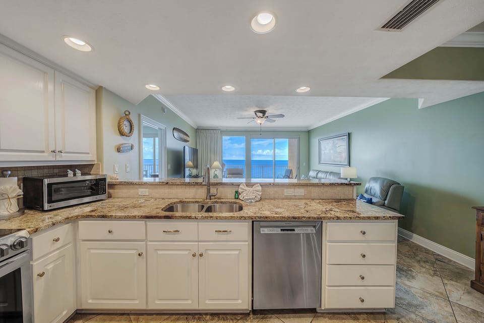 The fully equipped kitchen features granite countertops, stainless-steel appliances, and has everything you need to prepare meals for family & friends.