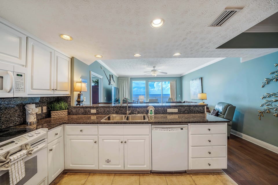 The fully equipped kitchen features granite countertops and everything you need to prepare meals for family & friends.